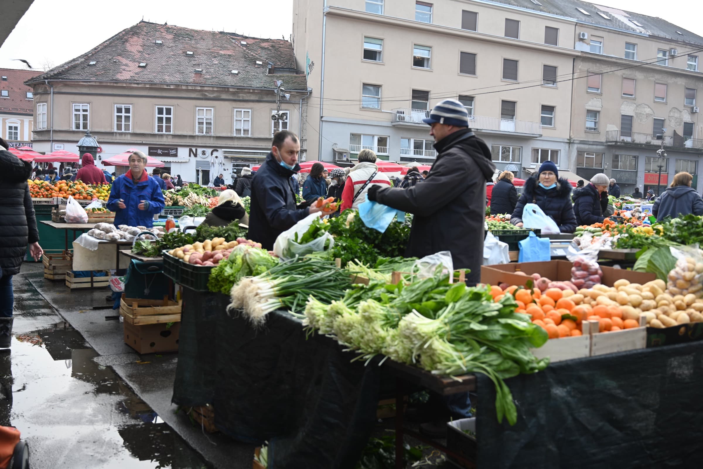 Vegetable stalls and shoppers at Dolac Market in Zagreb.