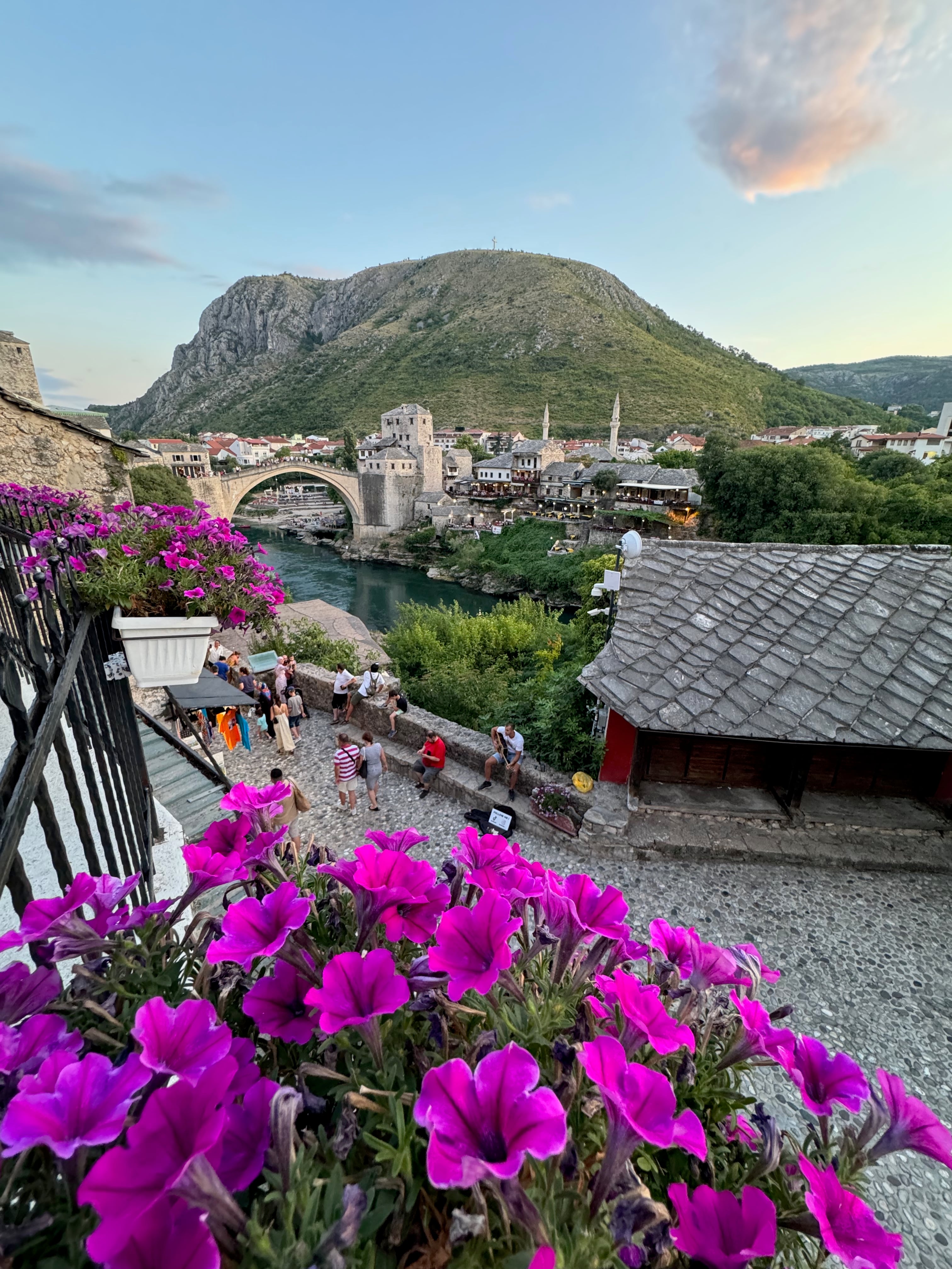 Kujundžiluk bazaar and Stari Most in Mostar framed by flowers.