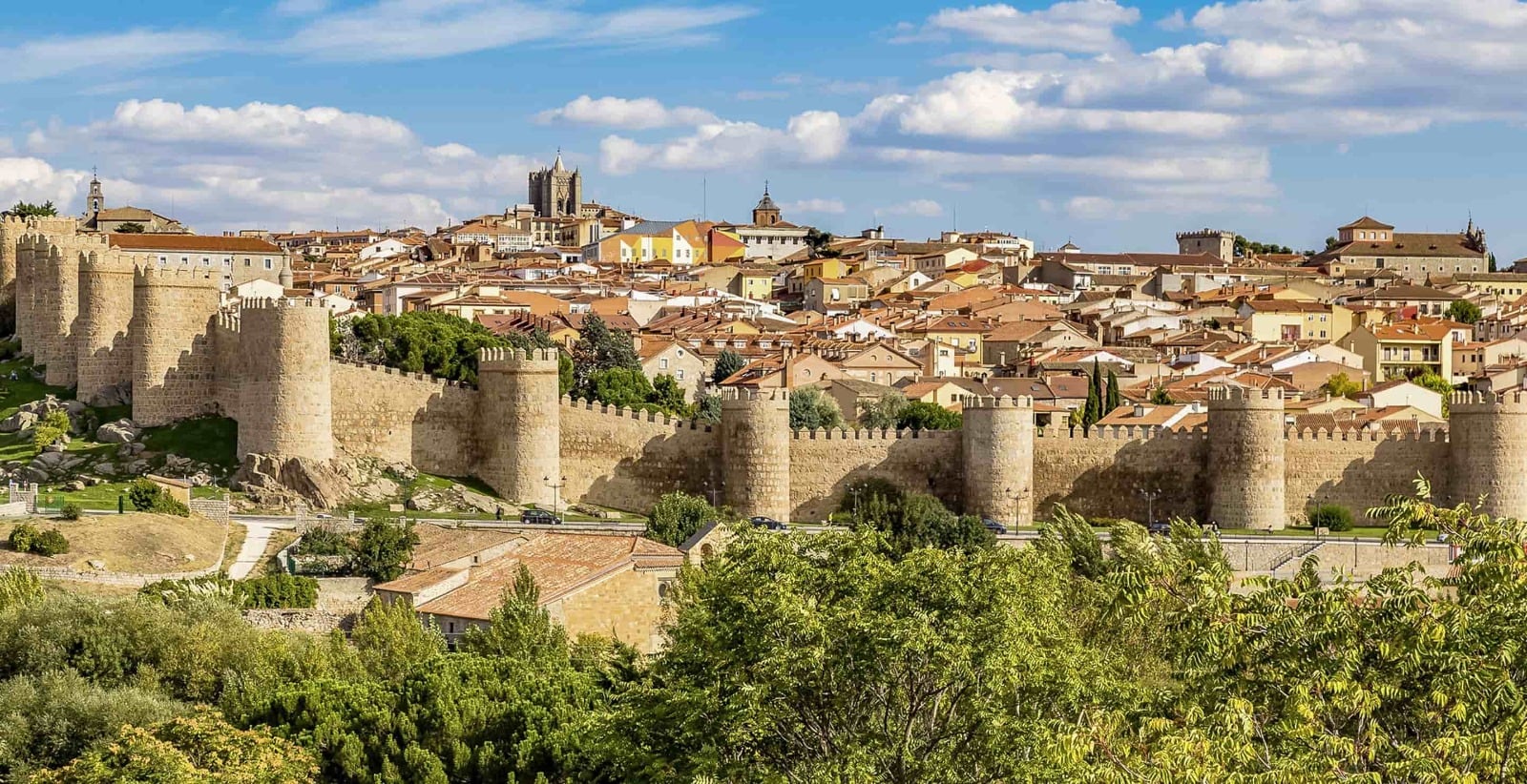 The medieval walls and old city of Ávila seen from Mirador de los Cuatro Postes.
