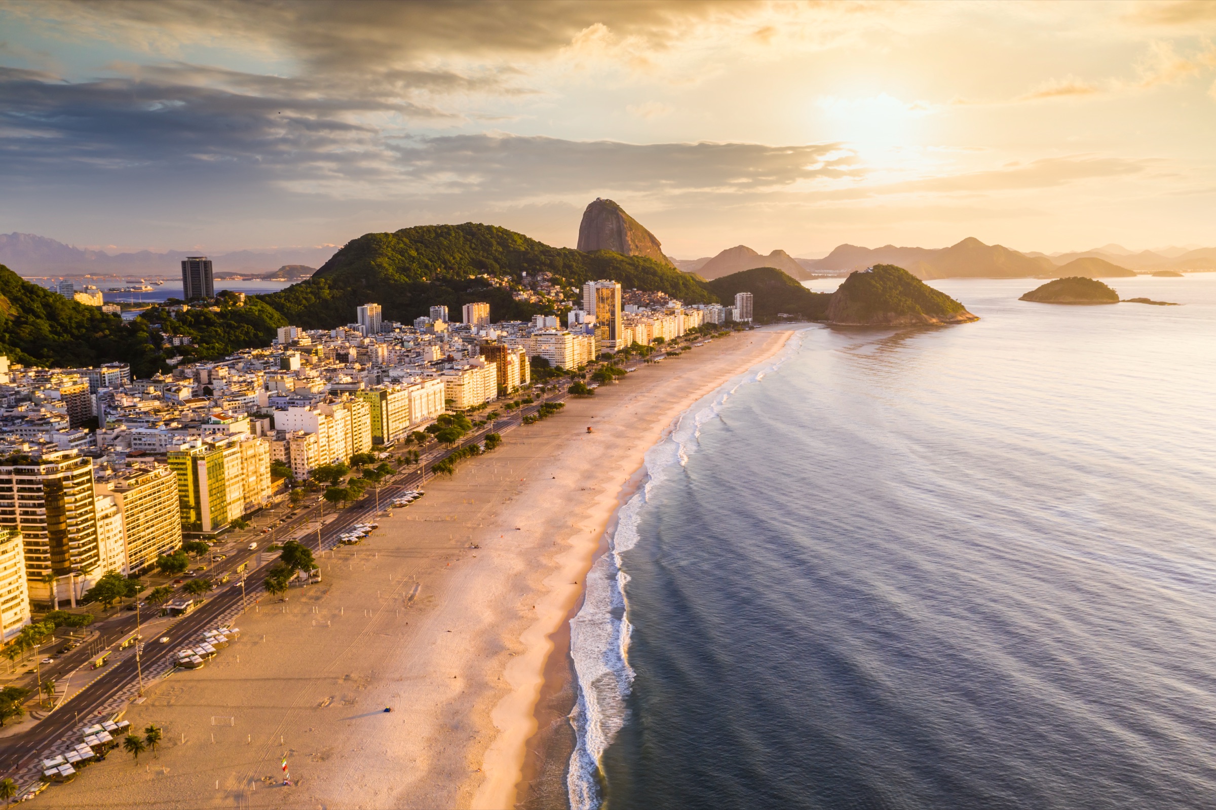 Rio de Janeiro at twilight with the coast and mountains.