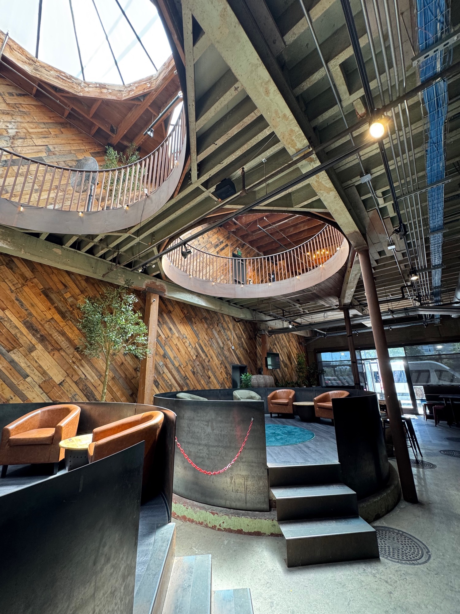 Reclaimed wood mezzanine deck above the brewing floor.