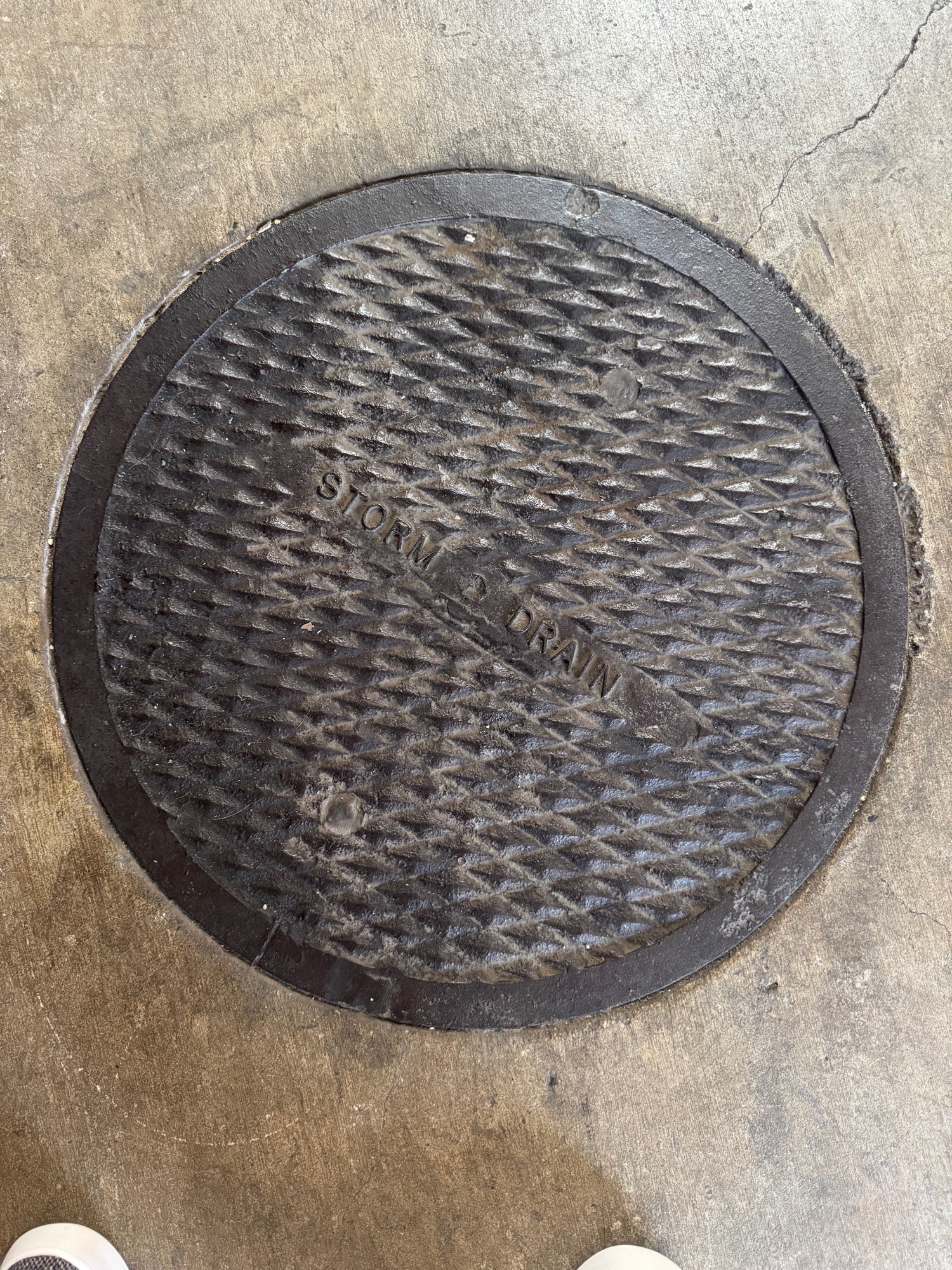 Salvaged manhole cover in the brewhouse floor.