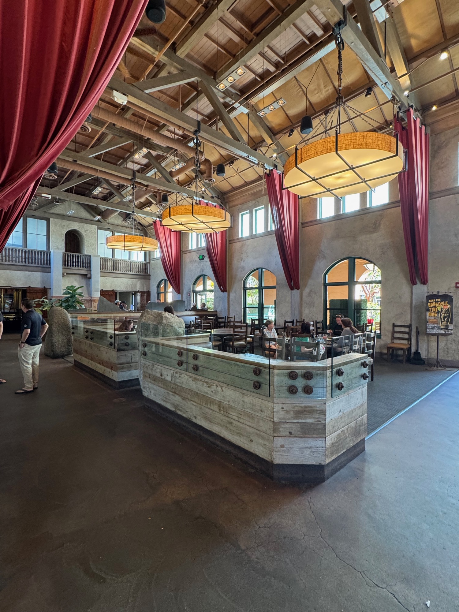 Vaulted clay-tile ceiling and exposed wood trusses inside the mess hall.